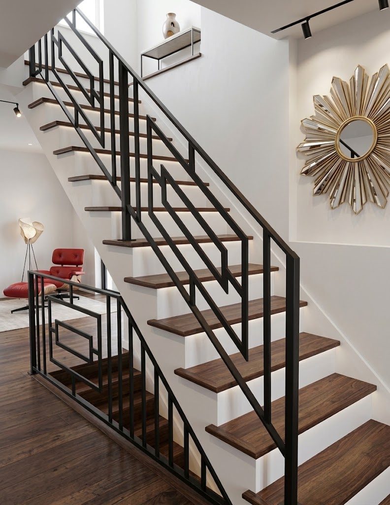 Modern geometric welded steel stair railing beside walnut open-riser treads